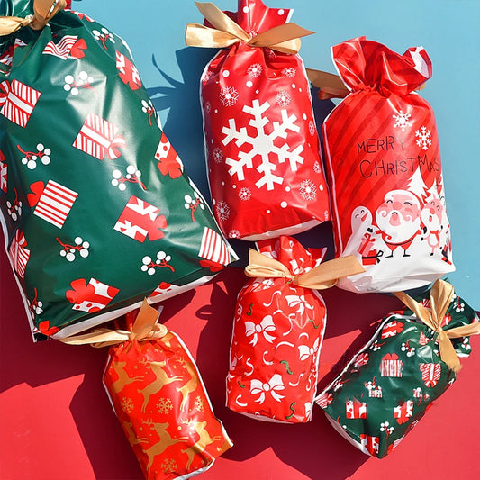 Colorful Christmas gift bags with drawstring featuring festive designs for holiday celebrations