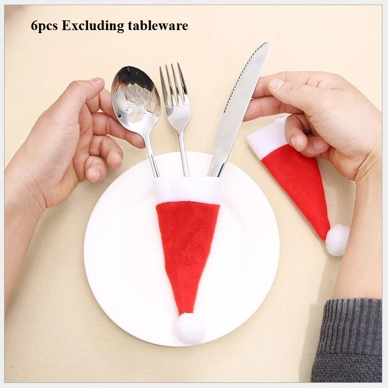 Six pieces of Christmas Hat Chair Covers and utensil holders in red and white design for festive dining