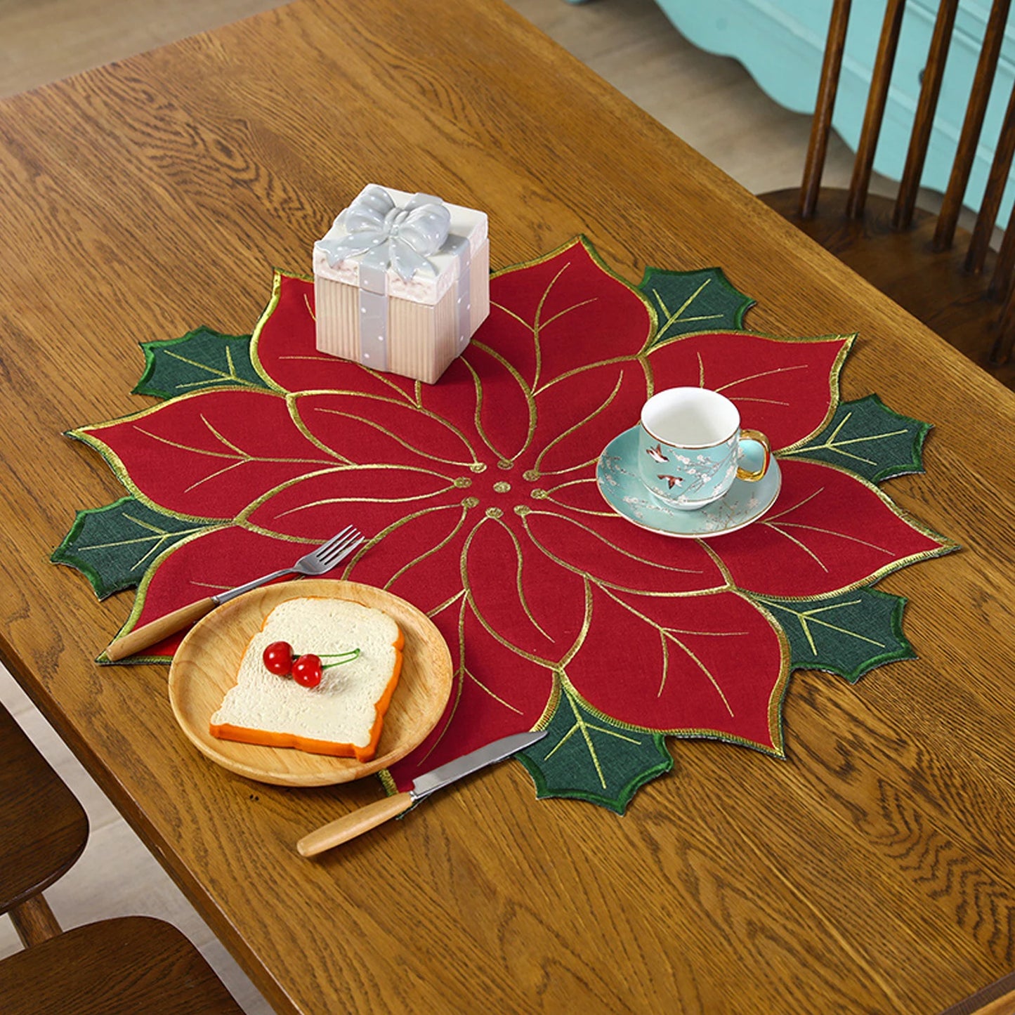 Christmas holly leaf placemat featuring a vibrant poinsettia design, perfect for holiday dining