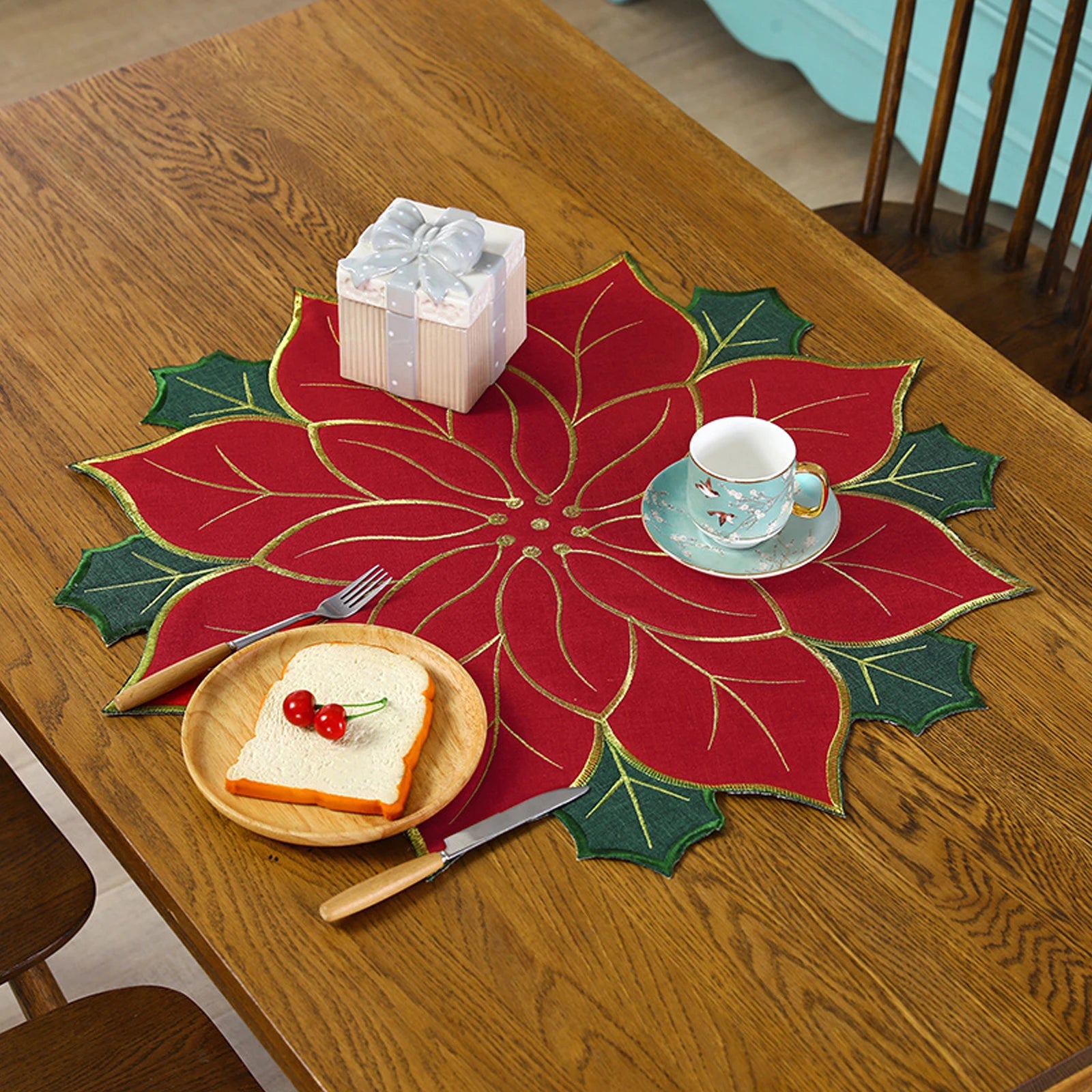 Christmas holly leaf placemat featuring a vibrant poinsettia design, perfect for holiday dining