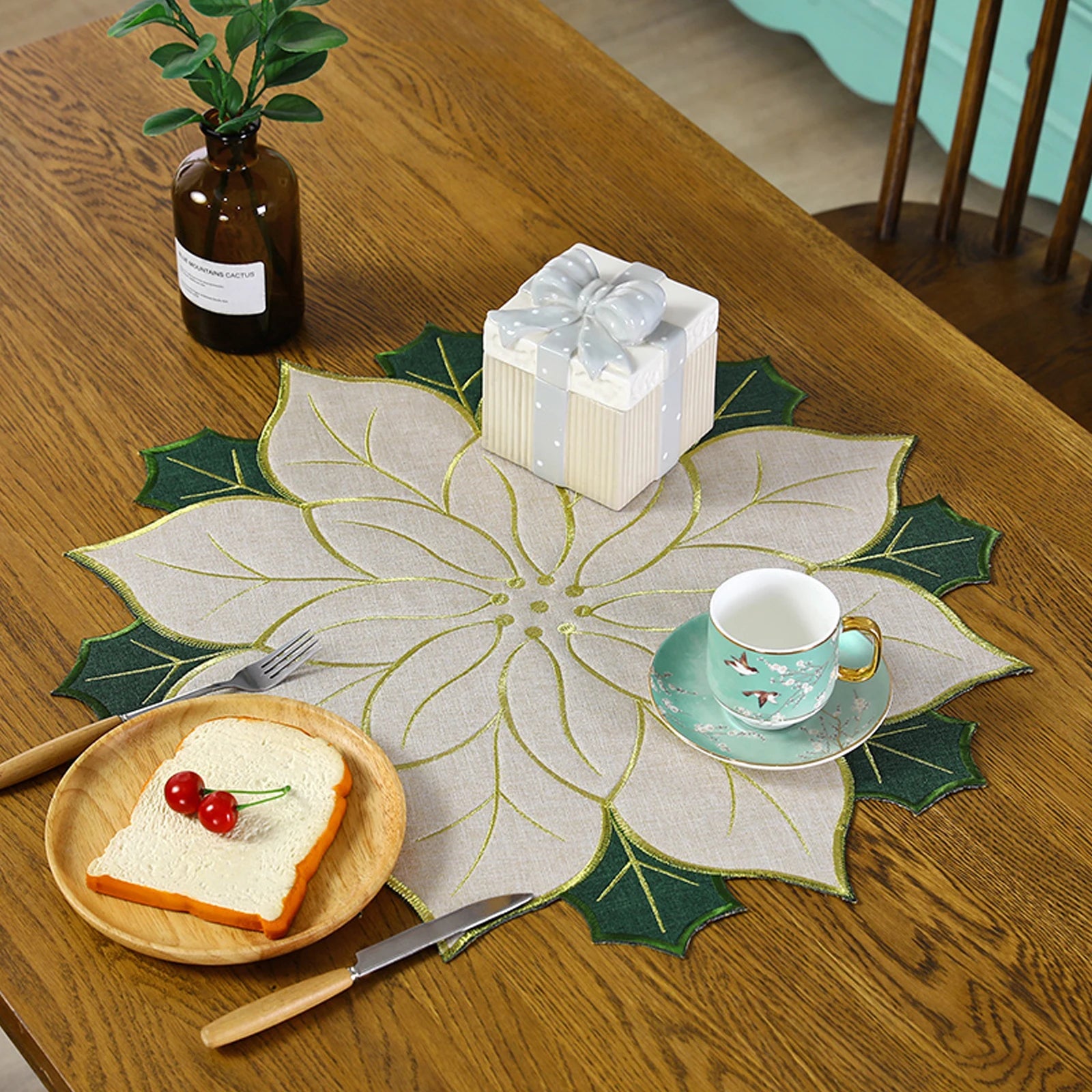 Christmas holly leaf placemat with intricate design, perfect for festive table settings