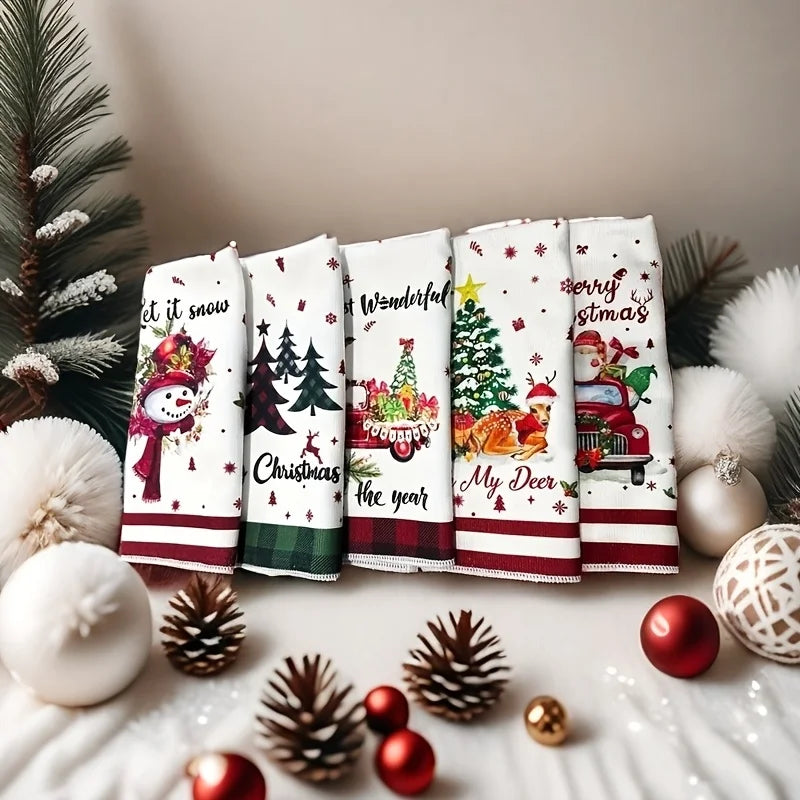 Set of Christmas kitchen towels with festive designs including snowmen and Christmas trees