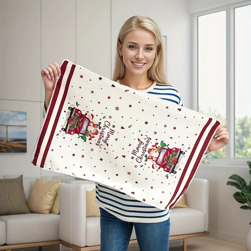 Woman holding a festive Christmas kitchen towels set featuring a vintage truck design with holiday decorations