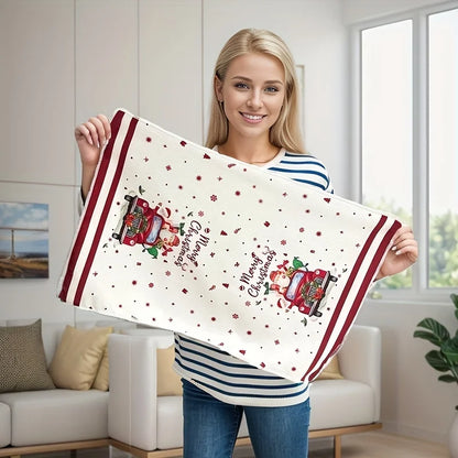 Woman holding a festive Christmas kitchen towels set featuring a vintage truck design with holiday decorations