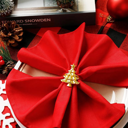 Nutshell Christmas napkin ring set featuring a decorative Christmas tree design on festive red napkins