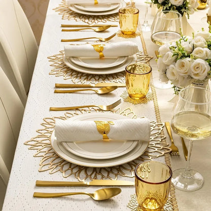 Elegant Christmas placemats on a beautifully arranged dining table with gold accents and floral centerpieces
