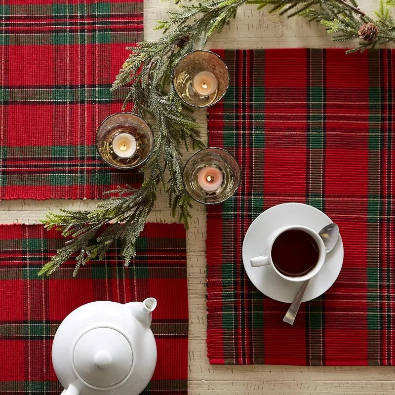 Christmas Plaid Placemats on a festive dining table with candles and tea set