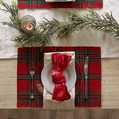 Elegant table setting with Christmas Plaid Placemats, red napkins, and holiday decor