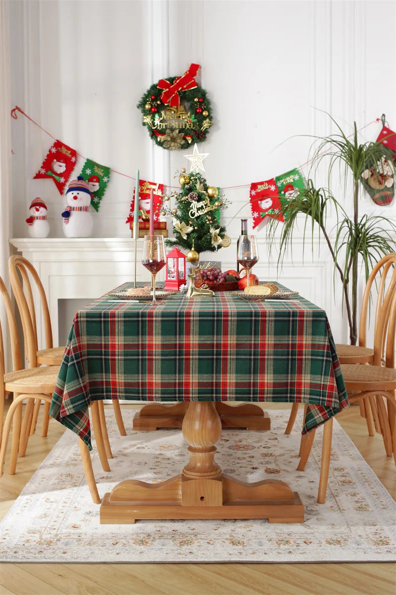 Christmas Plaid Tablecloth on a wooden dining table set for festive seasonal dining