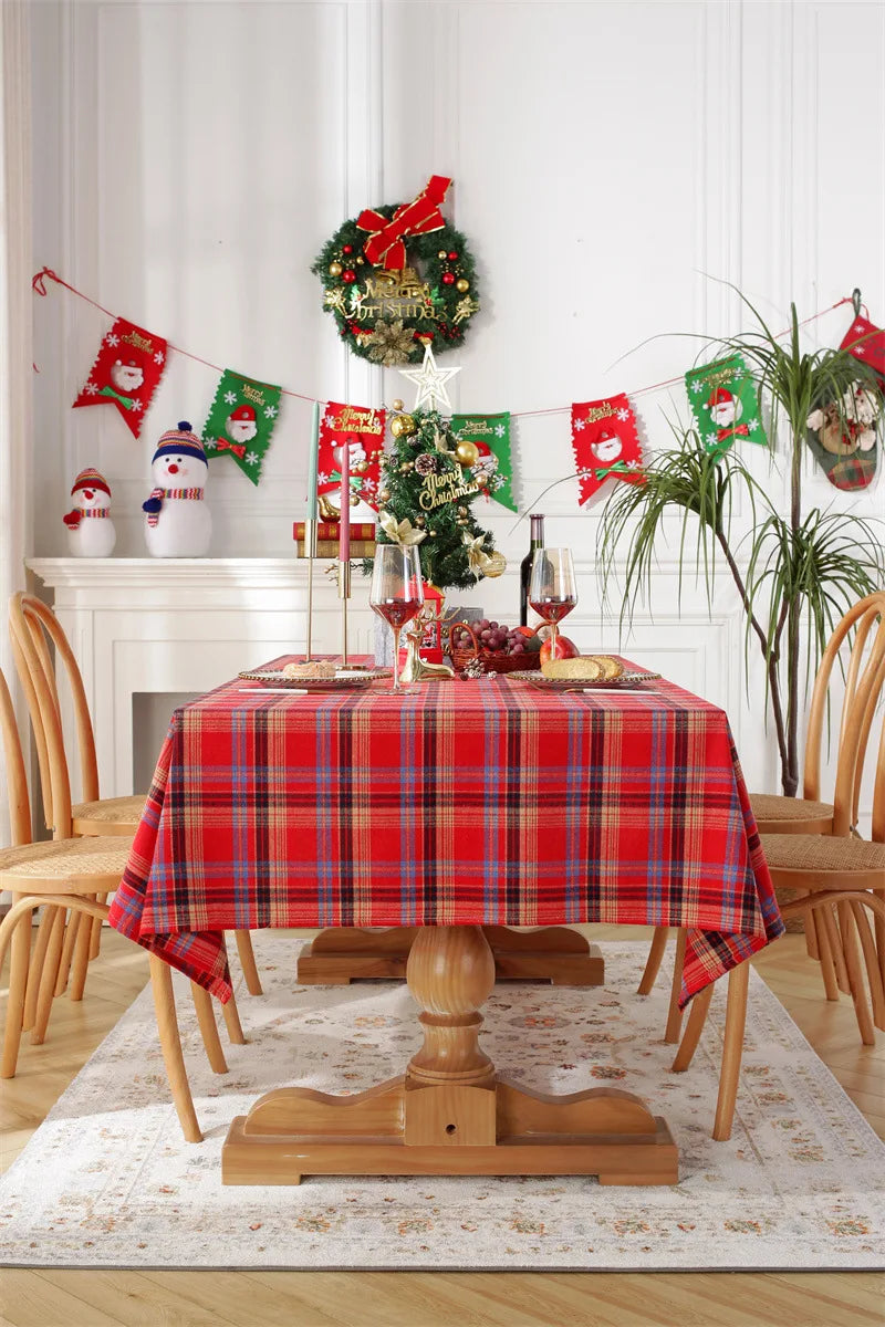 Christmas Plaid Tablecloth on a wooden dining table decorated for holiday festivities