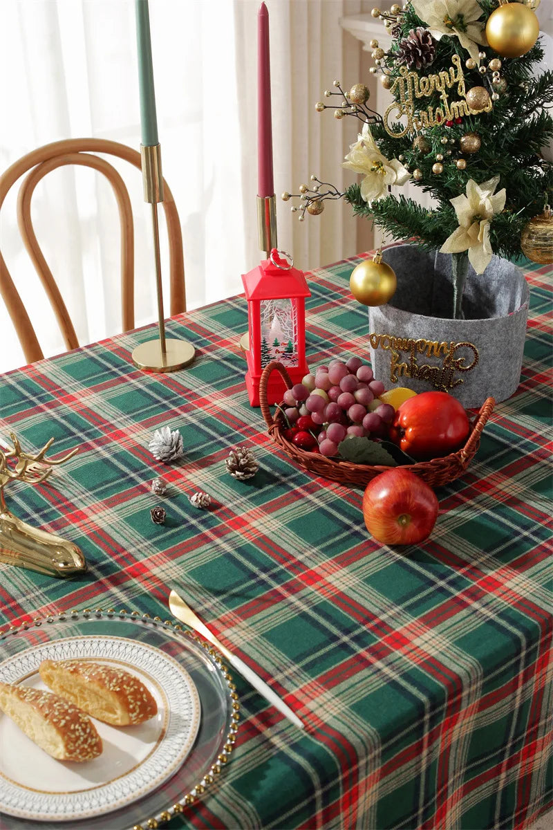 Christmas Plaid Tablecloth featuring green and red stripes, decorated with festive fruits and holiday accents