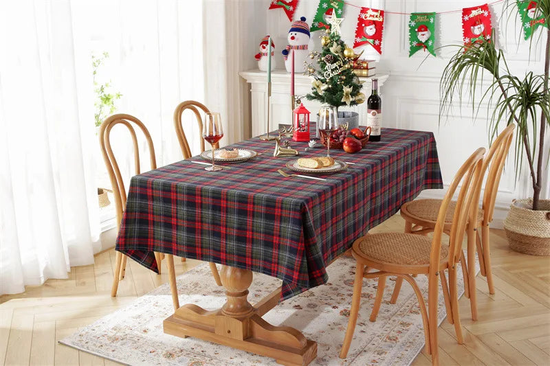 Christmas Plaid Tablecloth draped over a dining table set for a festive holiday meal