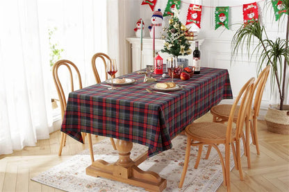 Christmas Plaid Tablecloth draped over a dining table set for a festive holiday meal