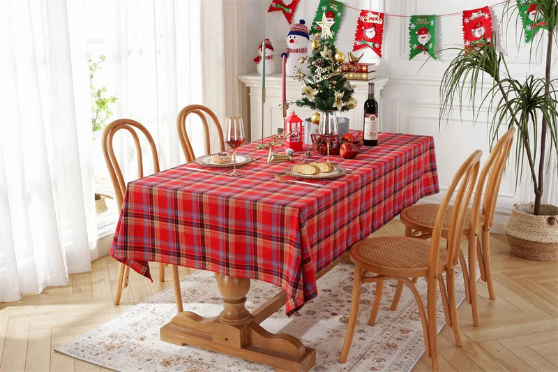 Christmas Plaid Tablecloth on a dining table set for holiday festivities with decorations