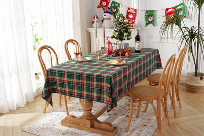 Christmas Plaid Tablecloth on a dining table decorated for a festive holiday gathering