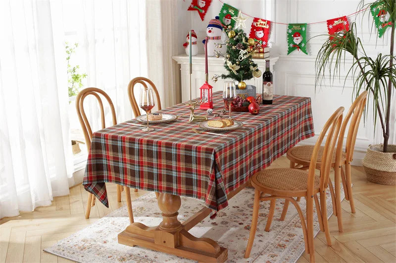 Christmas Plaid Tablecloth on a wooden dining table decorated for the holiday season