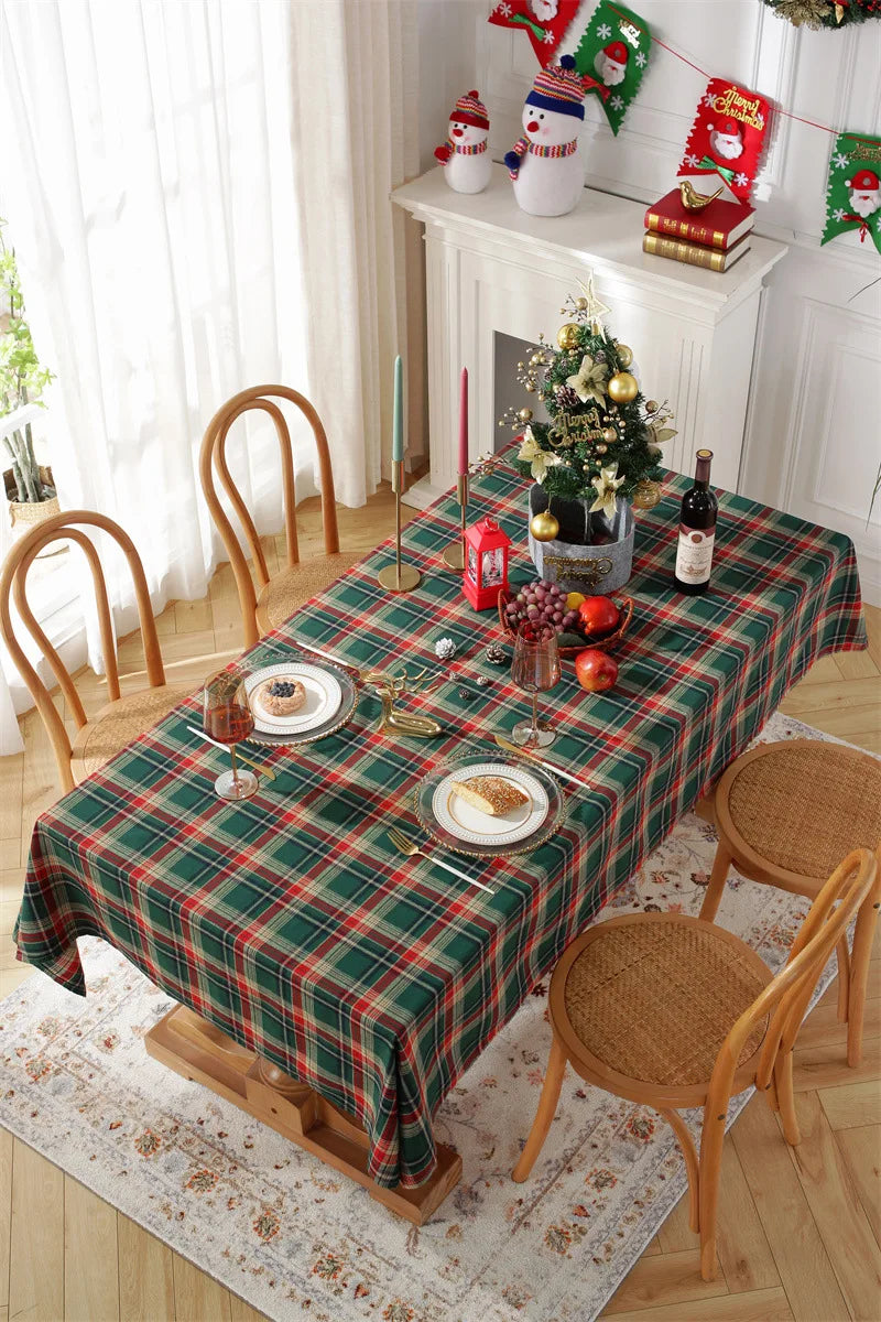 Christmas Plaid Tablecloth on a festive dining table with holiday decor and plates