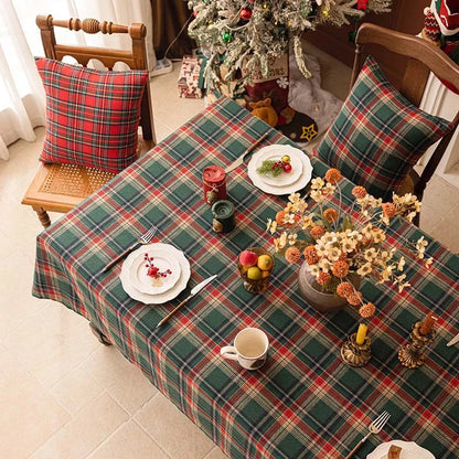 Christmas Plaid Tablecloth on a dining table with festive decorations and dishes