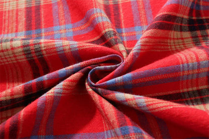 Christmas Plaid Tablecloth in vibrant red, blue, and black patterns for festive dining decor
