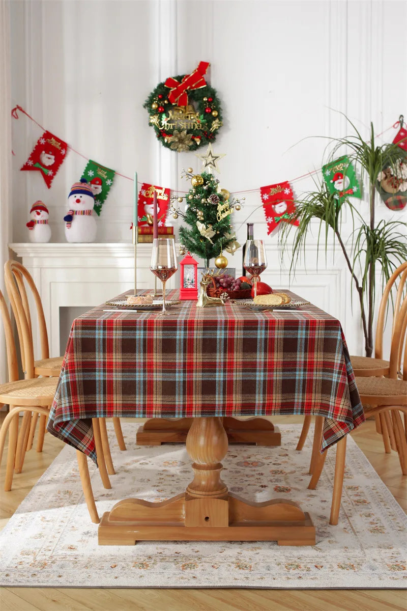 Christmas Plaid Tablecloth on a festive dining table set for holiday celebrations