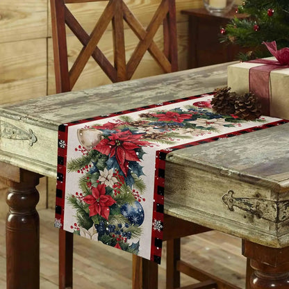 Christmas Poinsettia Flower Linen Table Runner on a rustic wooden table decorated for the holidays