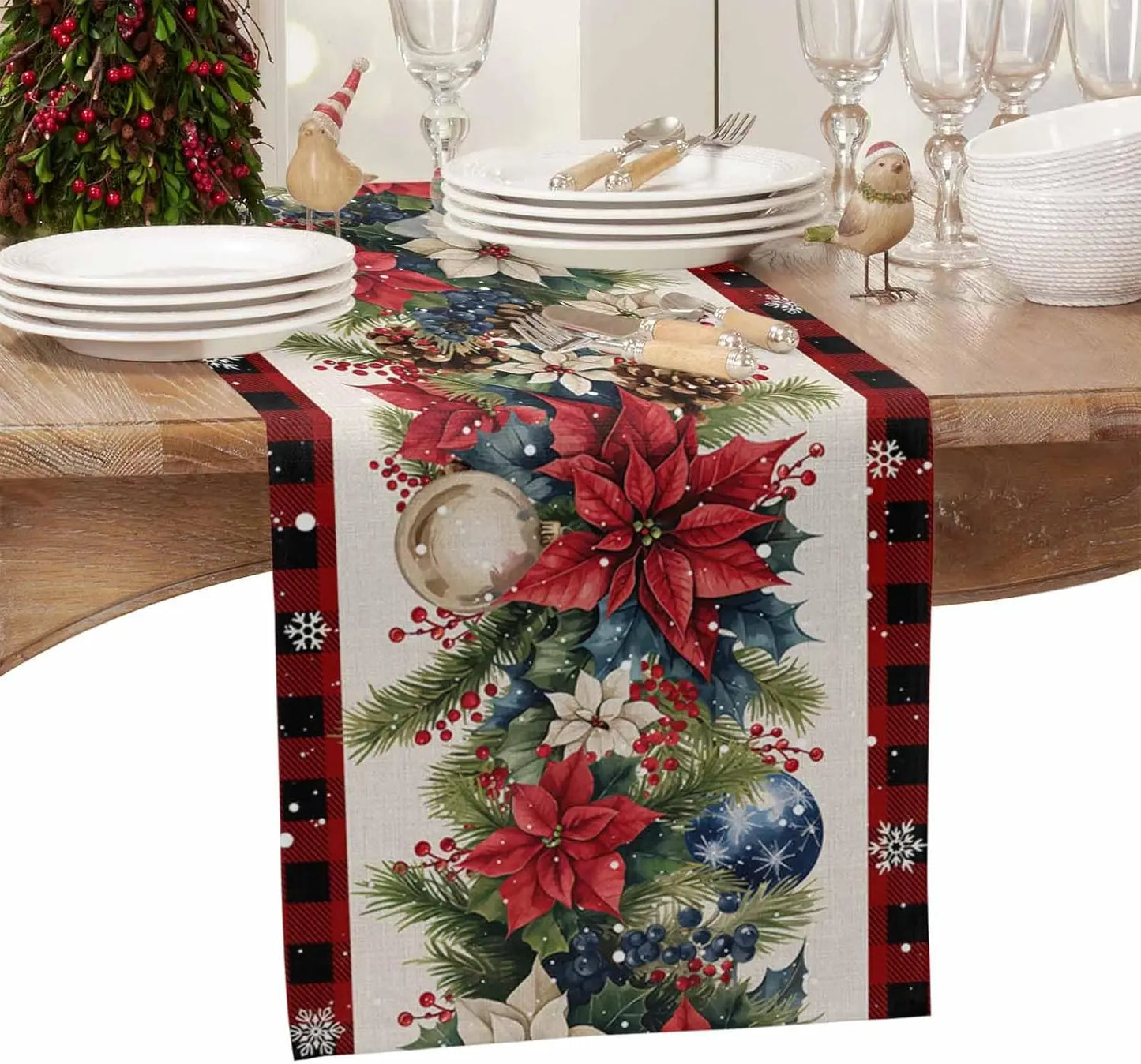 Christmas Poinsettia Flower Linen Table Runner with festive decorations on a wooden dining table