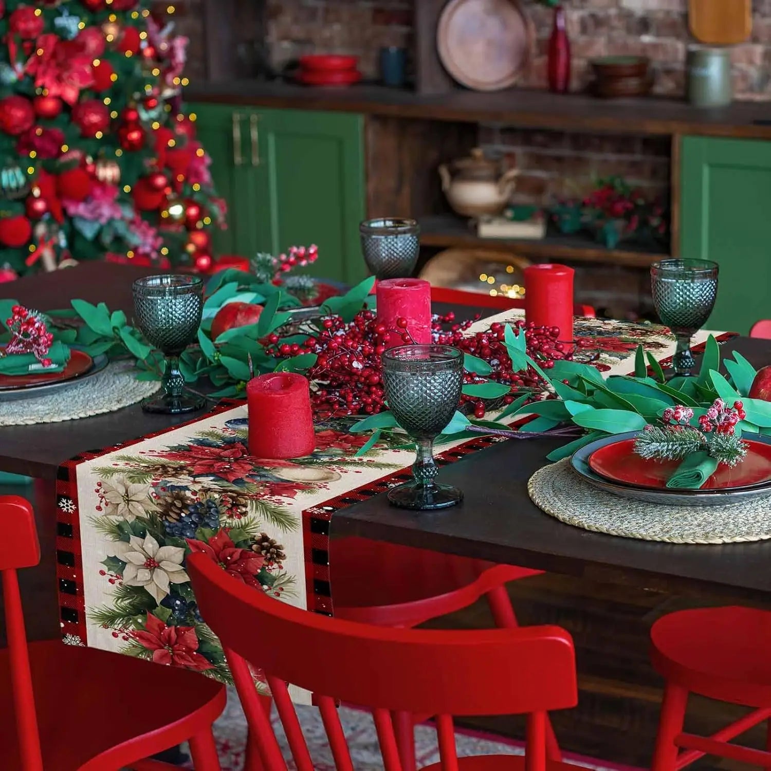 Christmas Poinsettia Flower Linen Table Runner on a festive dining table with red candles and green foliage