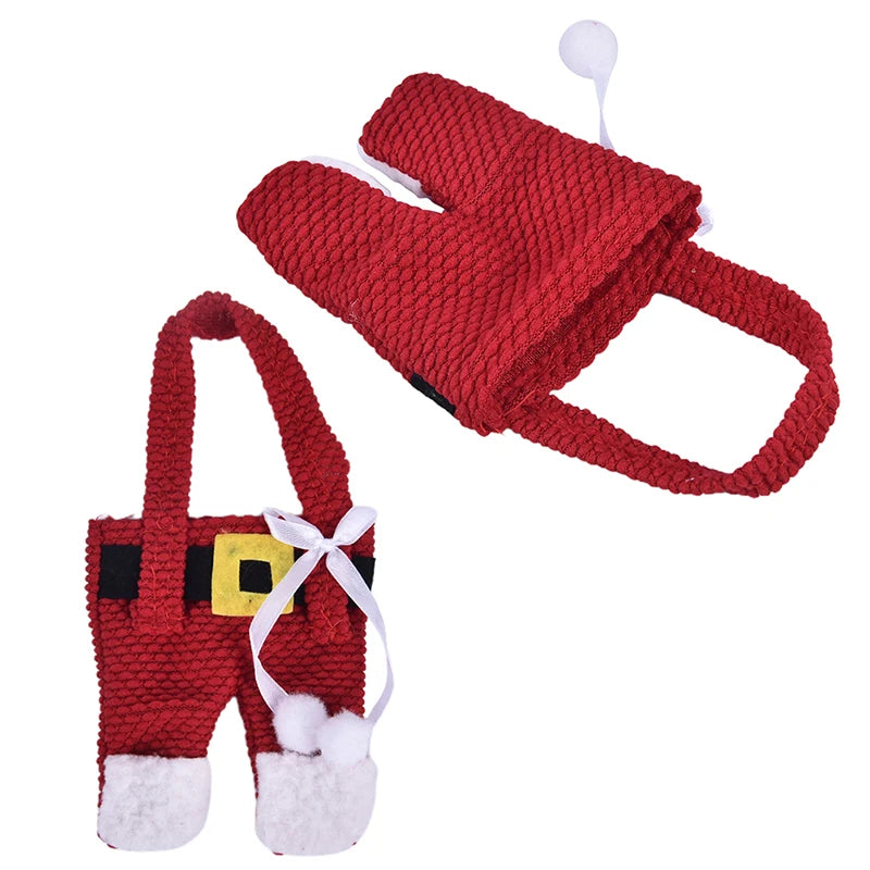 Christmas silverware holders in red Santa design with white pom poms and suspenders for festive dining