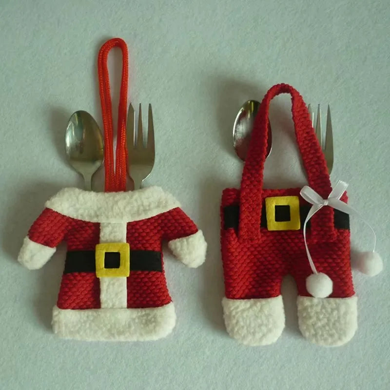Christmas silverware holders designed as Santa outfits for festive table settings