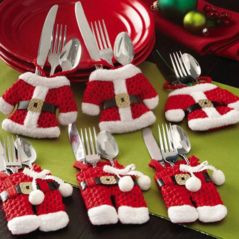 Festive Christmas silverware holders shaped like Santa suits for holiday table settings