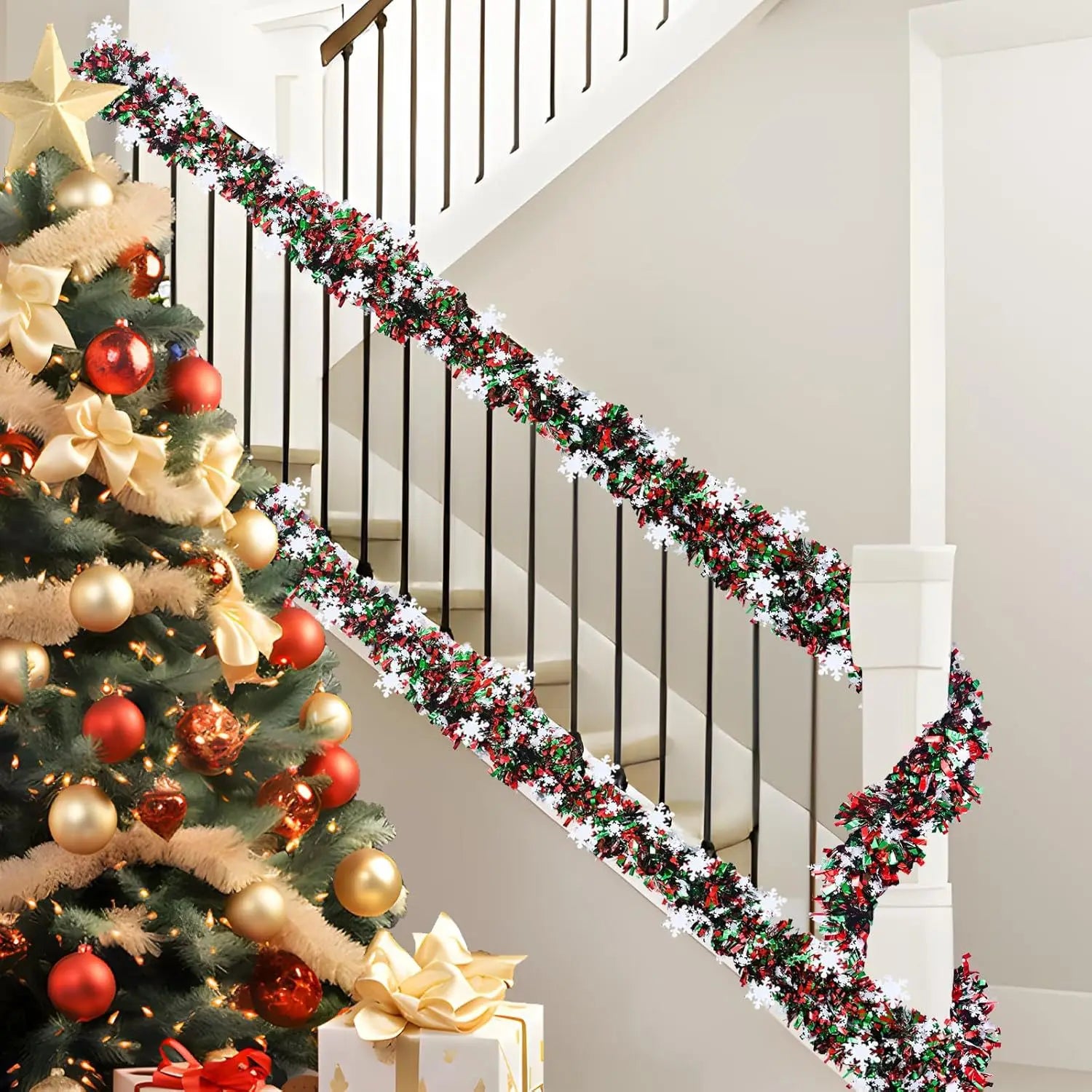 Christmas snowflake tinsel garland adorning a festive staircase with a decorated Christmas tree