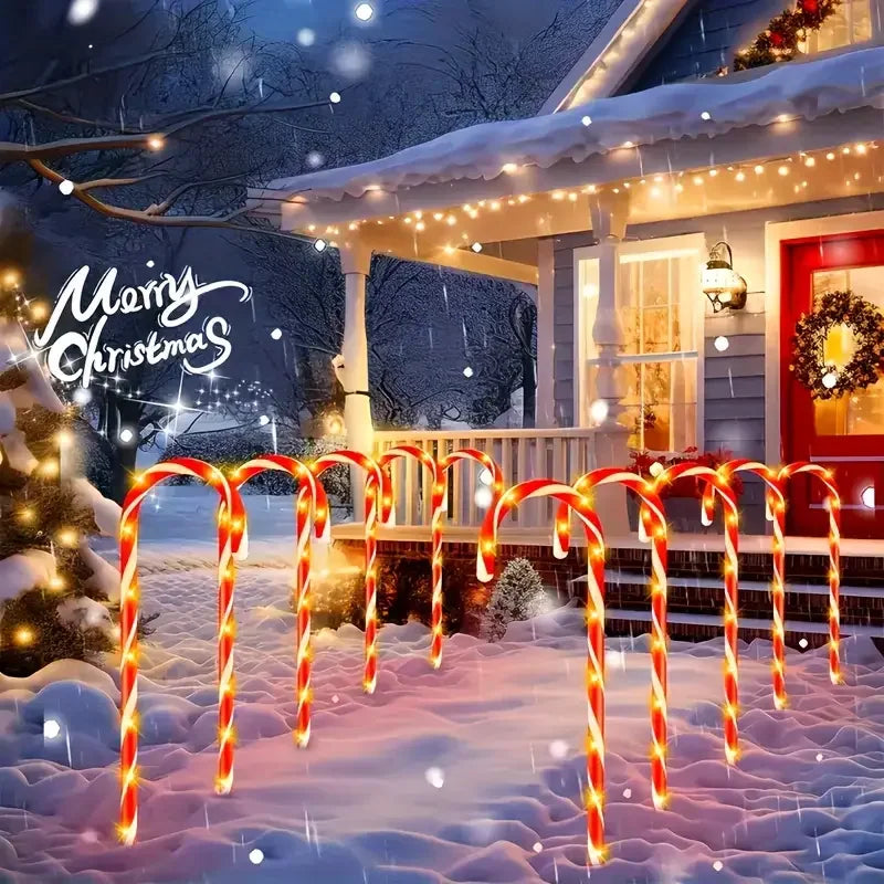 Festive Christmas solar candy cane lights illuminating a snowy porch with holiday decorations