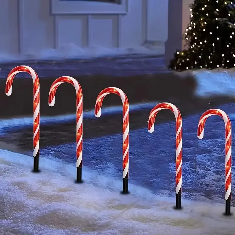 Set of Christmas solar candy cane lights in red and white for festive outdoor decorations