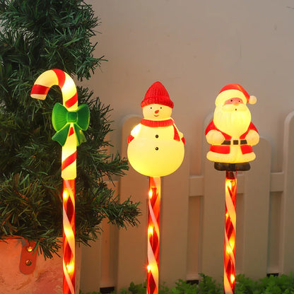 Christmas solar lawn lights set featuring a snowman, Santa, and candy cane decorations