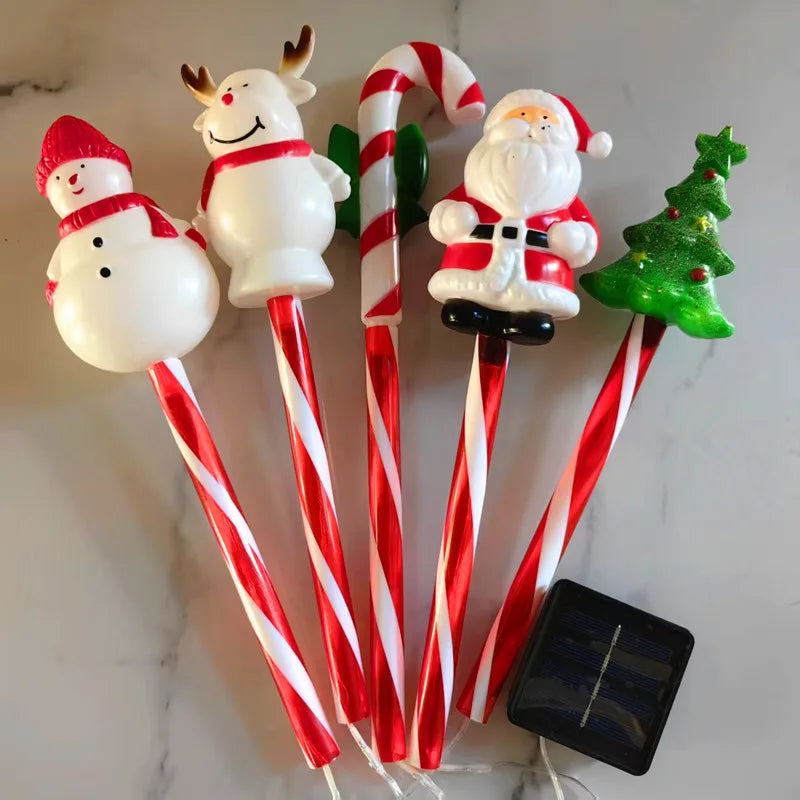 Christmas solar lawn lights set featuring fun holiday characters like Santa and a snowman