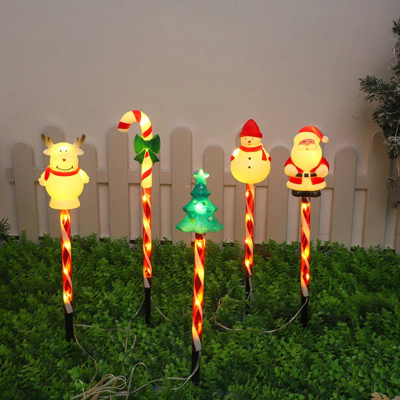 Christmas solar lawn lights set featuring festive characters like Santa, a snowman, and a reindeer