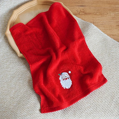 Red Christmas themed hand towels featuring an embroidered Santa design for festive decor