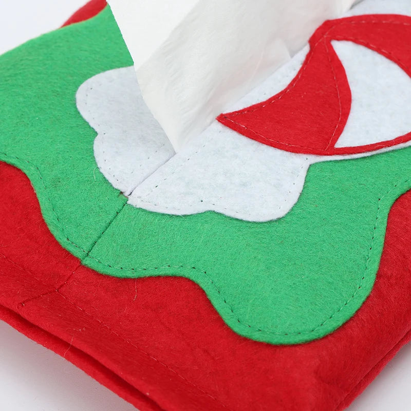 Christmas tissue box cover featuring festive green and red design with white accents for holiday decor