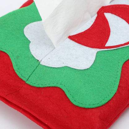 Christmas tissue box cover featuring festive green and red design with white accents for holiday decor