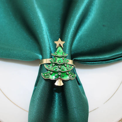 Gold and green Christmas Tree Napkin Rings with star design for festive table settings