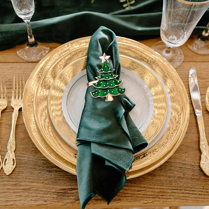 Nutshell Christmas tree napkin rings in festive design on an elegant dining table setting