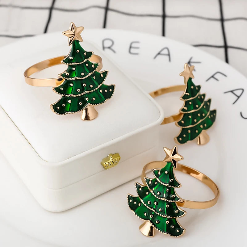Nutshell Christmas tree napkin rings in green with gold accents for festive holiday table settings