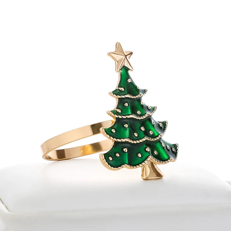 Nutshell Christmas tree napkin rings in green and gold for festive holiday table settings