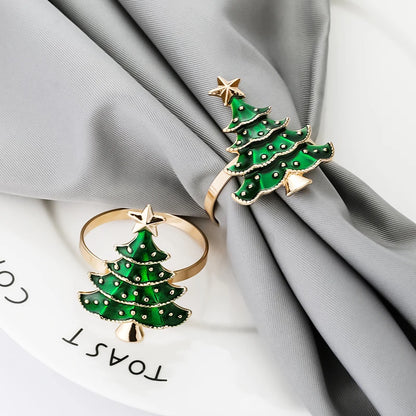 Nutshell Christmas tree napkin rings in gold and green for festive table settings
