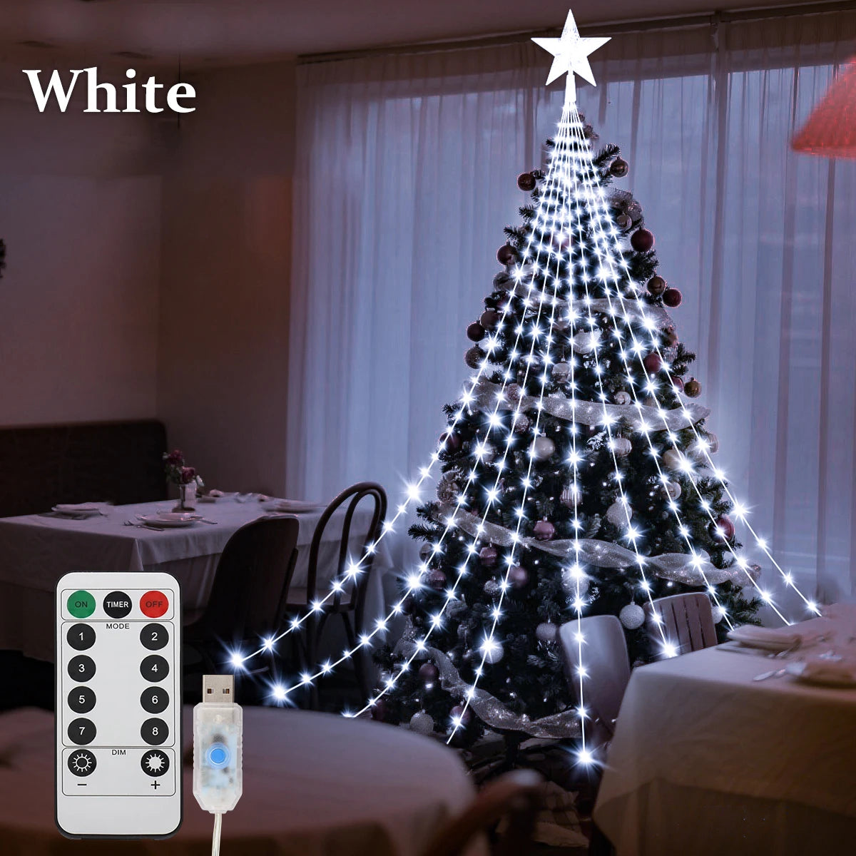 Christmas tree shooting star lights illuminating a decorated tree with a star on top