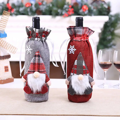 Christmas wine bottle covers featuring gnome designs in gray and red with plaid accents and snowflake details