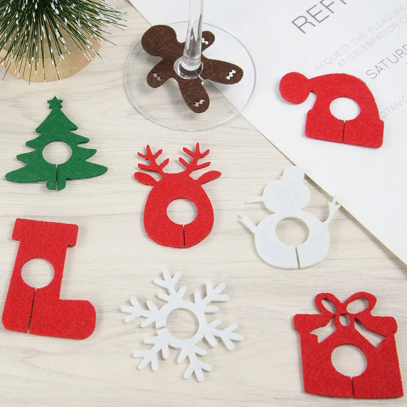 Nutshell Christmas wine glass charms set featuring festive designs like trees and snowmen in colorful felt