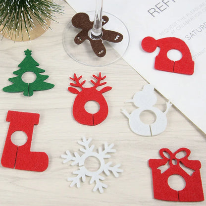 Nutshell Christmas wine glass charms set featuring festive designs like trees and snowmen in colorful felt