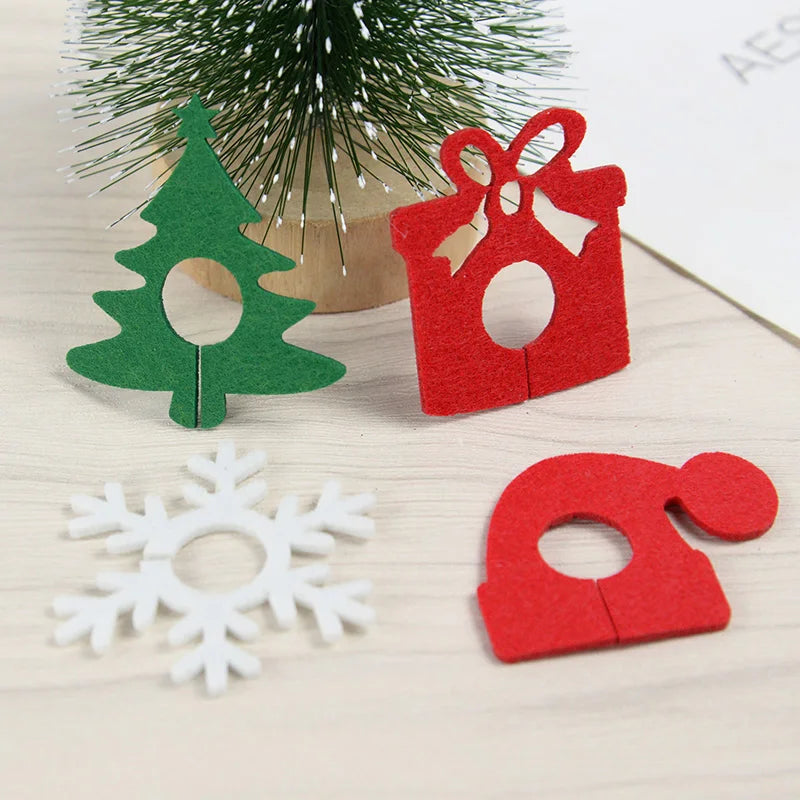 Christmas wine glass charms set featuring festive designs like a tree, gift, snowflake, and Santa hat