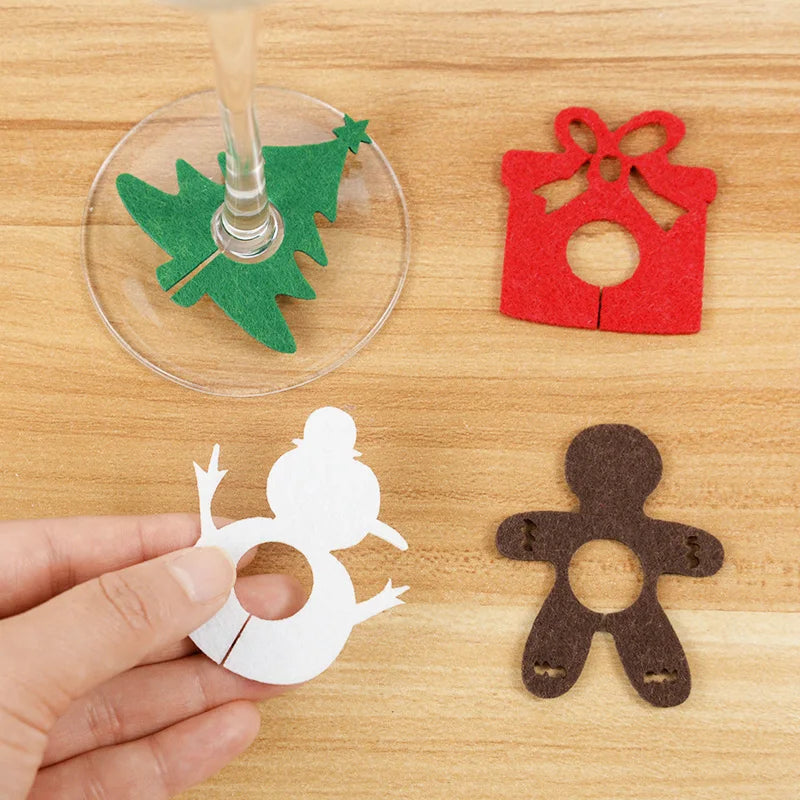Christmas wine glass charms set featuring colorful felt designs like a tree, gift, snowman, and gingerbread man